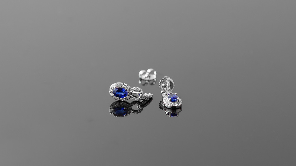 Sapphire ear rings on glass